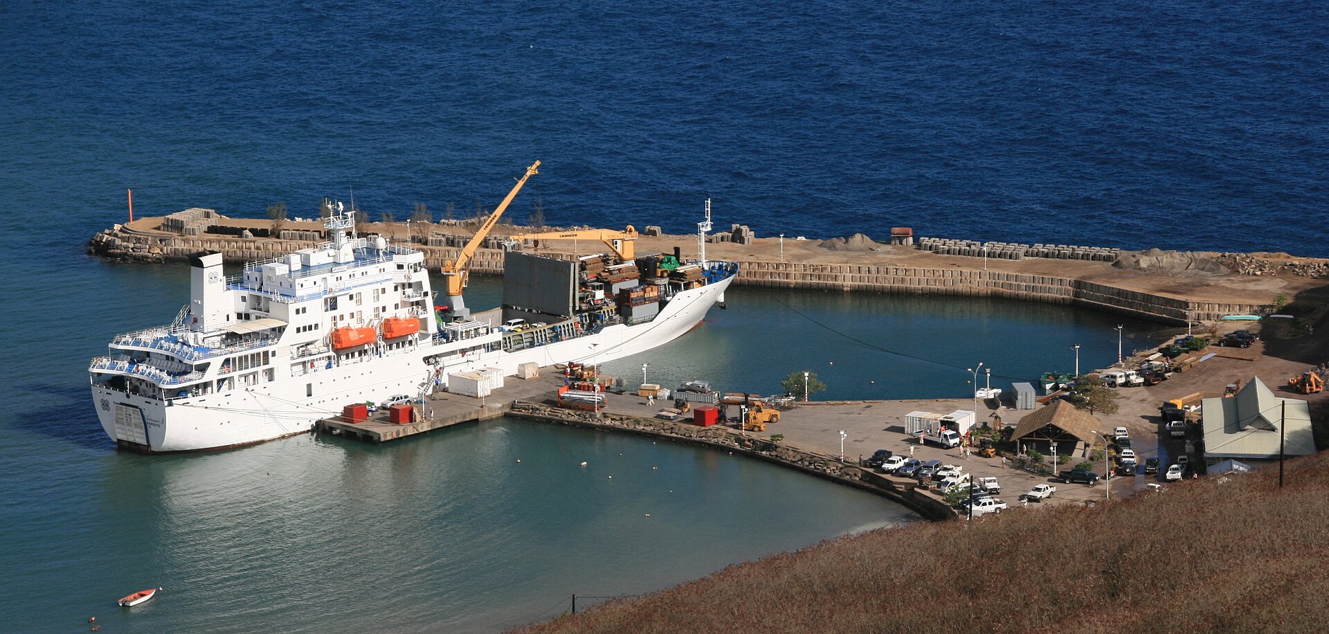 The Aranui freighter anchored below the spires of Ua Pou