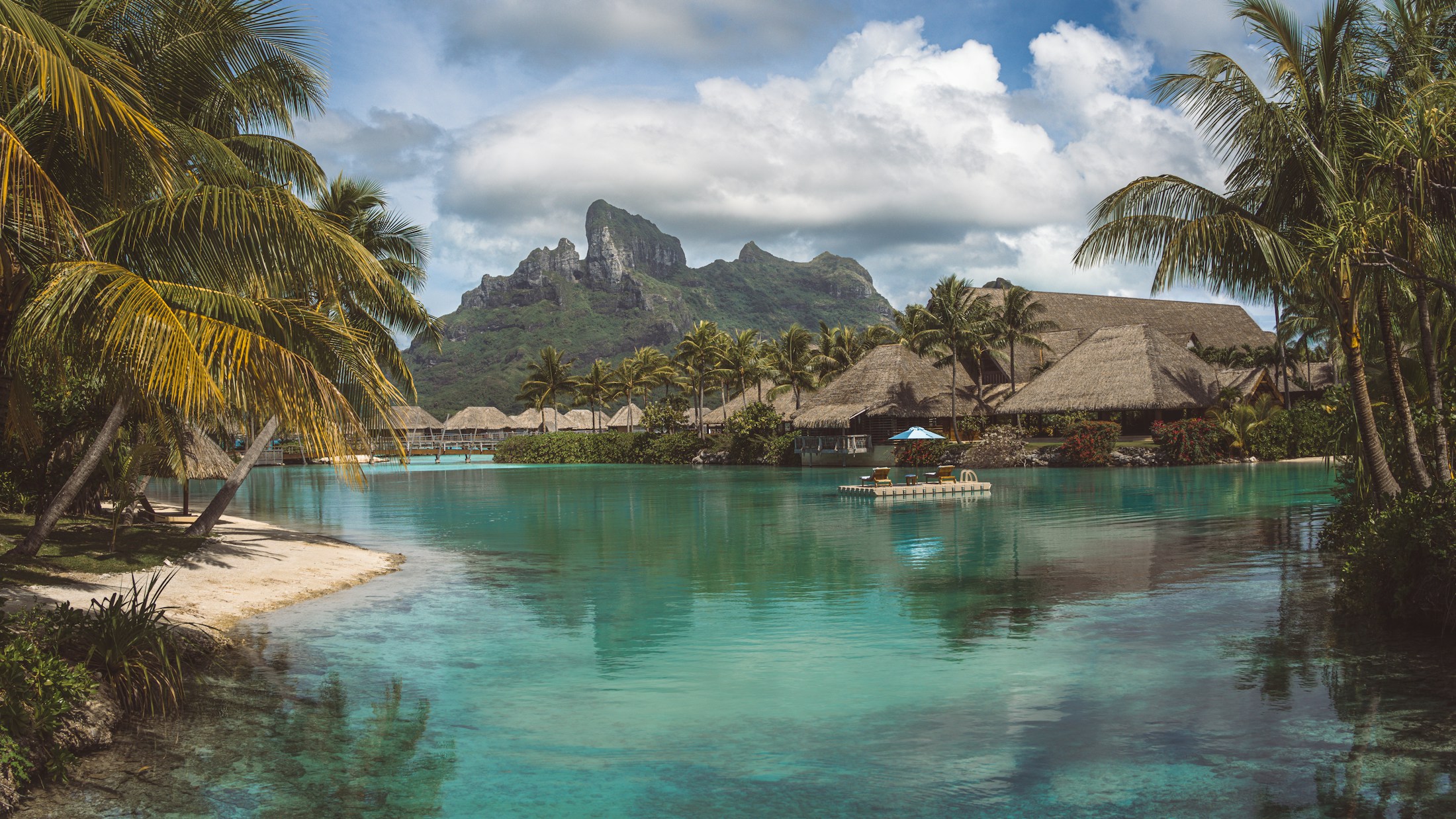 A canoe crossing the turquoise lagoon at Bora Bora